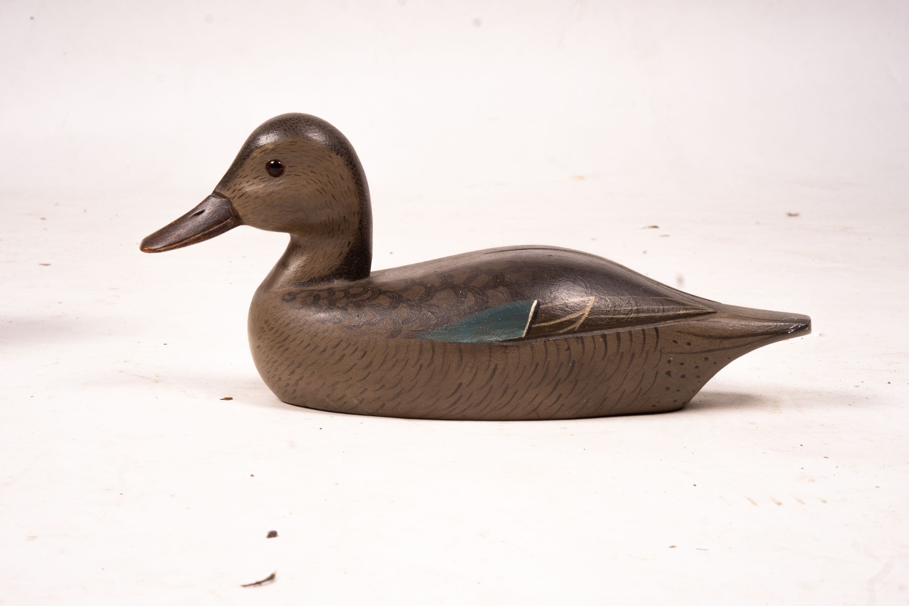 Three American carved and painted decoy duck ornaments, largest 48cm long